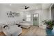 Cozy living room with a comfortable sectional sofa, wood flooring, and natural light filtering through the windows at 1021 Harlan St, Indianapolis, IN 46203