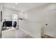 Bright office with a white desk and chair, featuring a window for natural light at 1021 Harlan St, Indianapolis, IN 46203