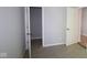 Neutral bedroom features carpeted floor with open doorway to walk-in closet at 10544 Maidenhair Dr, Indianapolis, IN 46239