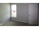 Bedroom with carpeted floor, neutral gray walls and a bright window at 10544 Maidenhair Dr, Indianapolis, IN 46239