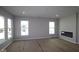 Bright living room featuring recessed lighting, lots of windows, and a modern fireplace at 10544 Maidenhair Dr, Indianapolis, IN 46239