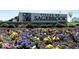 Villas at Sagebrook West community sign surrounded by colorful spring flowers at 10544 Maidenhair Dr, Indianapolis, IN 46239