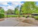 Lovely backyard with lush green lawn, concrete patio, and manicured landscaping at 10559 Rolling Springs Dr, Indianapolis, IN 46234