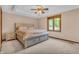 Bedroom featuring a double bed and a window overlooking the backyard at 10559 Rolling Springs Dr, Indianapolis, IN 46234