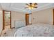 Bright bedroom featuring a double bed, closet space, and ensuite bath at 10559 Rolling Springs Dr, Indianapolis, IN 46234