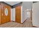 Entryway featuring a decorative front door and wood-look floors, creating a warm welcome at 10559 Rolling Springs Dr, Indianapolis, IN 46234