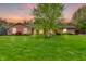 Lovely brick home with lush green lawn and healthy landscaping, perfect for outdoor enjoyment at 10559 Rolling Springs Dr, Indianapolis, IN 46234