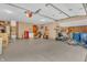Spacious three car garage with epoxy flooring and ample storage space at 10559 Rolling Springs Dr, Indianapolis, IN 46234