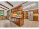 Kitchen featuring wood cabinets, stainless steel appliances, and wood floors at 10559 Rolling Springs Dr, Indianapolis, IN 46234