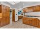 Kitchen featuring wood cabinets and stainless steel appliances, with bonus breakfast bar at 10559 Rolling Springs Dr, Indianapolis, IN 46234