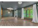 Open living room with lots of natural light, laminate flooring and stylish decor at 10559 Rolling Springs Dr, Indianapolis, IN 46234