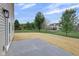 Spacious backyard with fresh straw and a concrete patio, offering a blank canvas for outdoor living at 1147 Kelsneland Dr, Avon, IN 46123