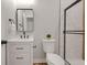 Well-lit bathroom featuring a modern vanity with a sleek black faucet, and a walk-in shower with a glass door at 1147 Kelsneland Dr, Avon, IN 46123