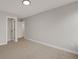 Bright bedroom with neutral walls and carpet, featuring a doorway and recessed lighting at 1147 Kelsneland Dr, Avon, IN 46123