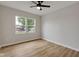 Bright, airy bedroom featuring wood-look floors and double windows at 1147 Kelsneland Dr, Avon, IN 46123