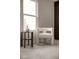 Comfortable bedroom seating area with natural light from the window and modern decor at 1147 Kelsneland Dr, Avon, IN 46123