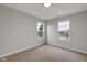 Clean bedroom design featuring neutral carpet and two bright windows with neighborhood views at 1147 Kelsneland Dr, Avon, IN 46123
