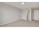 An empty bedroom with neutral carpet, walls, with a doorway to another room at 1147 Kelsneland Dr, Avon, IN 46123