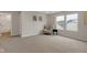 Bright, carpeted bedroom with large windows and neutral decor, complete with stylish seating and open bath access at 1147 Kelsneland Dr, Avon, IN 46123