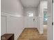 Welcoming foyer with wood-look floors, white trim, and a stylish rug at 1147 Kelsneland Dr, Avon, IN 46123