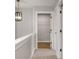 Hallway view showcasing wood-look flooring leading into a room with wire shelving at 1147 Kelsneland Dr, Avon, IN 46123