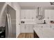 Modern kitchen featuring white cabinets, stainless steel appliances, and a stylish countertop at 1147 Kelsneland Dr, Avon, IN 46123
