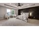 Large main bedroom with decorative wall, ceiling fan, recessed lighting, and two bright windows at 1147 Kelsneland Dr, Avon, IN 46123