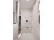 Bright, modern marble shower featuring a sleek shower system and glass enclosure at 1147 Kelsneland Dr, Avon, IN 46123