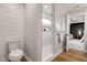 Modern marble-look shower with built-in niche, glass door and matte black shower head and hardware at 1147 Kelsneland Dr, Avon, IN 46123