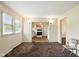 Spacious living room with an open layout, window views, and transitions to the kitchen at 1235 N Grant Ave, Indianapolis, IN 46201