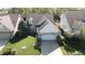 An elevated view of a single Gathering home with a well kept lawn and mature landscaping at 12551 Hawks Landing Dr, Fishers, IN 46037