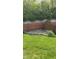 A well maintained backyard with a border that has rocks and a garden at 12551 Hawks Landing Dr, Fishers, IN 46037