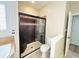Modern bathroom featuring a walk-in shower with glass door and tile surround, plus toilet at 12551 Hawks Landing Dr, Fishers, IN 46037