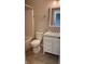 Cozy bathroom features a toilet, tub, and vanity with a marble countertop and white cabinets at 12551 Hawks Landing Dr, Fishers, IN 46037