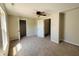 Neutral bedroom featuring carpet floors, closet, and a ceiling fan at 12551 Hawks Landing Dr, Fishers, IN 46037