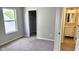 Neutral bedroom featuring carpet floors, closet, and an ensuite bathroom at 12551 Hawks Landing Dr, Fishers, IN 46037