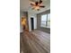 Bedroom with wood floors, ceiling fan, closet, and natural light from a window at 12551 Hawks Landing Dr, Fishers, IN 46037