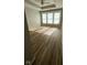 Spacious bedroom with wood floors, ceiling fan and multiple windows at 12551 Hawks Landing Dr, Fishers, IN 46037