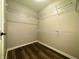 Walk-in closet with wire shelving and laminate floors offers ample storage space at 12551 Hawks Landing Dr, Fishers, IN 46037