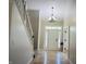 Bright entryway featuring tile floors, a staircase, and a front door with glass panels for natural light at 12551 Hawks Landing Dr, Fishers, IN 46037