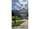 Well-maintained home featuring lush green lawn and a classic mailbox by the sidewalk at 12551 Hawks Landing Dr, Fishers, IN 46037