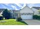 Charming single-Gathering home featuring a two-car garage and well-manicured lawn at 12551 Hawks Landing Dr, Fishers, IN 46037