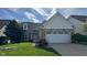 Charming home featuring a brick facade, dormer window and well-manicured front lawn at 12551 Hawks Landing Dr, Fishers, IN 46037