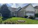 Charming home featuring a brick facade, dormer window and well-manicured front lawn at 12551 Hawks Landing Dr, Fishers, IN 46037
