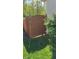 A wooden gate and fence provides privacy to the well manicured backyard at 12551 Hawks Landing Dr, Fishers, IN 46037