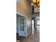 Grand foyer leading to a spacious living area, accentuated by a striking chandelier at 12551 Hawks Landing Dr, Fishers, IN 46037
