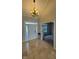 Elegant foyer with tiled floors, a decorative chandelier, and a view into the living spaces at 12551 Hawks Landing Dr, Fishers, IN 46037