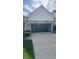 Spacious two-car garage with an open door, ready for your vehicles and storage at 12551 Hawks Landing Dr, Fishers, IN 46037