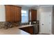 Kitchen boasts wood cabinets, tile backsplash, stainless steel appliances, and a garden window at 12551 Hawks Landing Dr, Fishers, IN 46037