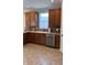 Kitchen features wood cabinets, tile backsplash, stainless steel appliances, and a window over the sink at 12551 Hawks Landing Dr, Fishers, IN 46037